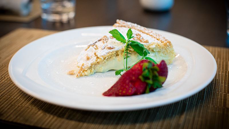 Smooth and sweet custard cream pie served with strawberry.